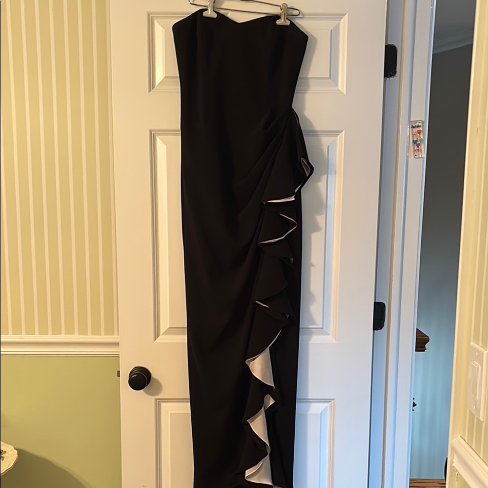 Bagley Mishka  long  Ruffled Strapless Gown. Fitted throughout .